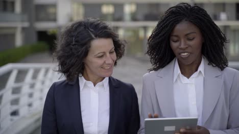 Happy-businesswomen-with-tablet-pc